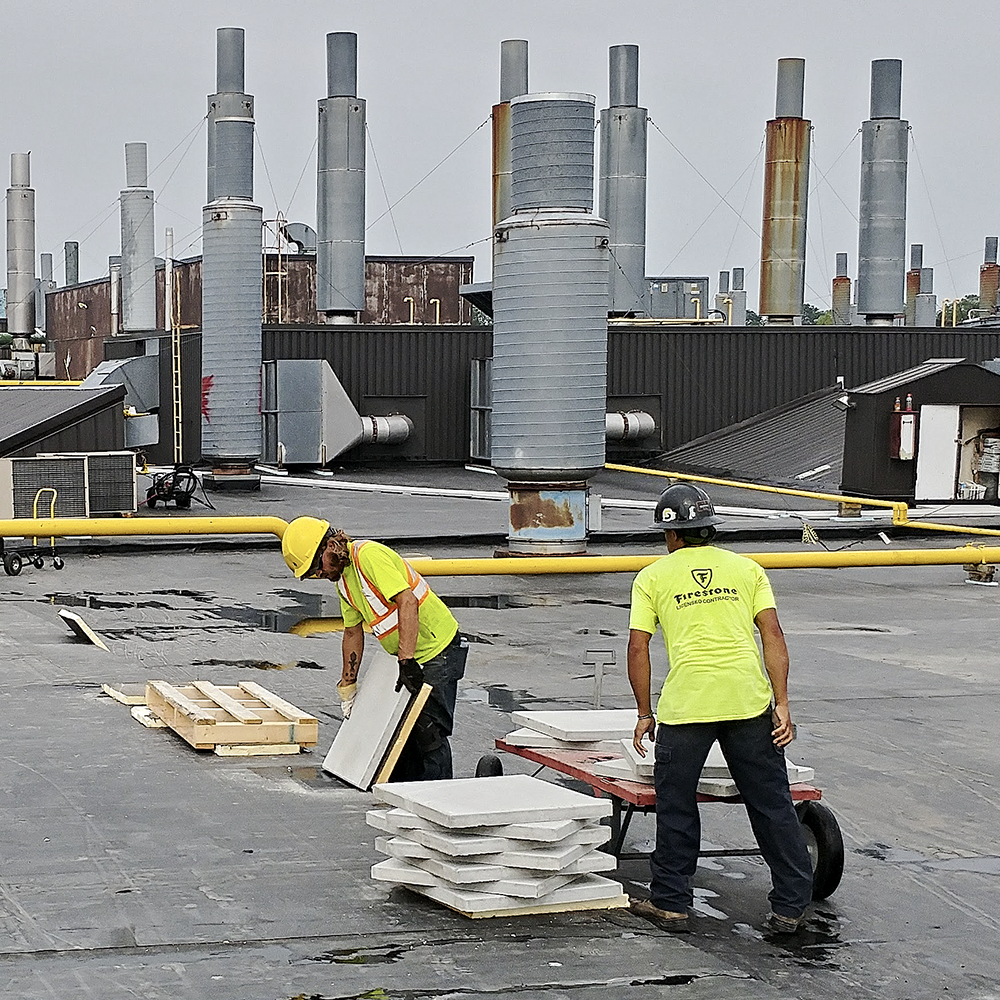 Roofers Preparing For Industrial Flat Roof Repair